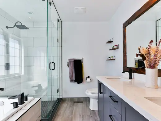 Clean modern bathroom with a glass shower and white vanity