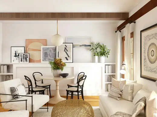 Tidy living and dining room with white furniture and wood floors
